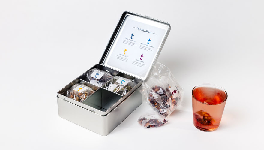 The Cold Brews tasting menu caddy with a glass of iced tea