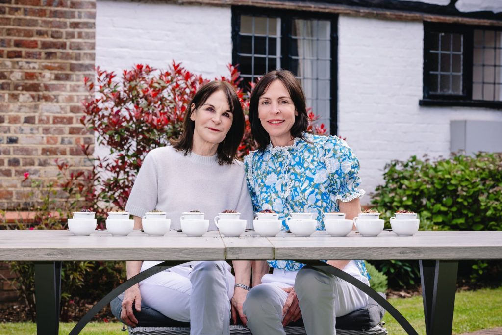 Nicky and Claire, the mother and daughter who founded Twist, at a table of tea tastings at Pollards Farm