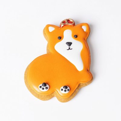 A handmade, hand-iced King Corgi gingerbread biscuit