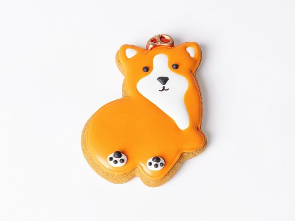 A handmade, hand-iced King Corgi gingerbread biscuit