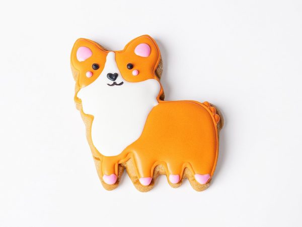 A handmade, hand-iced Princess Corgi gingerbread biscuit