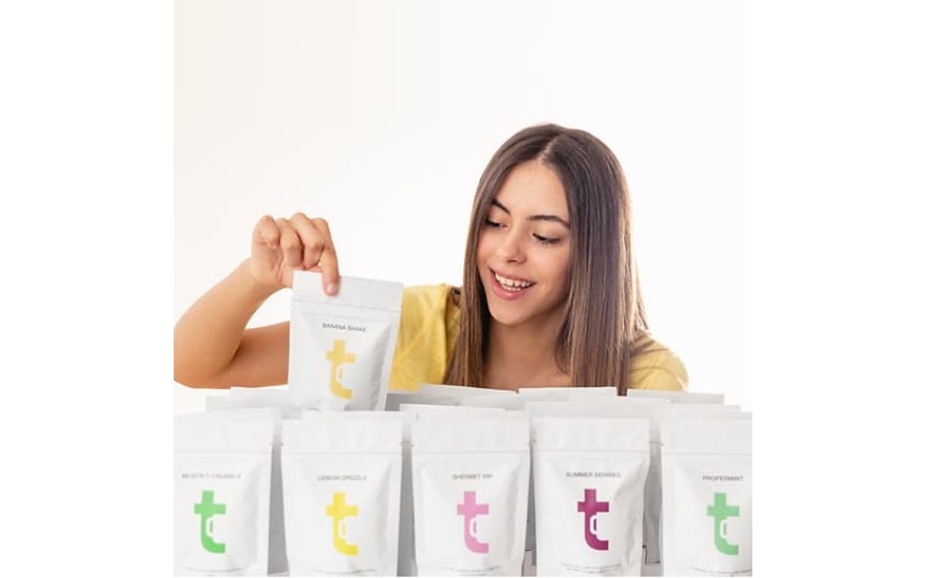 Choosing a Twist tea pouch from the Tea Club selection