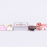 The Tea and Biscuits Caddy with The Nutcracker biscuits and a cup of tea