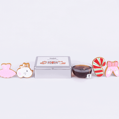 The Tea and Biscuits Caddy with The Nutcracker biscuits and a cup of tea