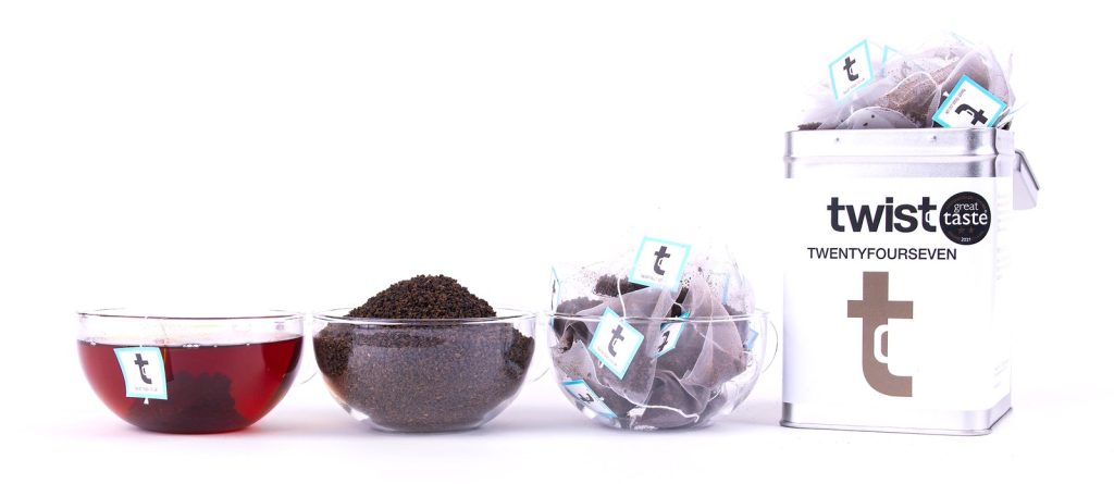 Twist Black Tea: a cup of tea, the loose leaf and the caddy