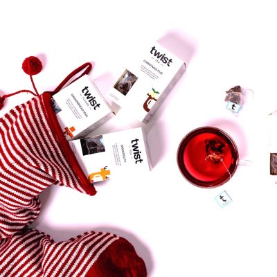 Christmas tea cartons beside a red stocking