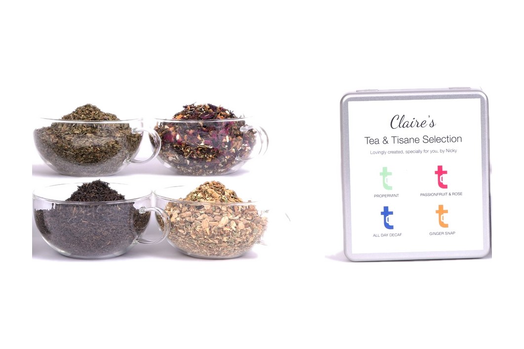 Four glass bowls of loose leaf tea beside a personalised four section caddy