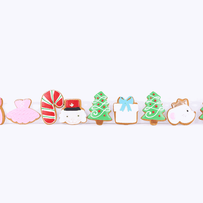Hand-iced Christmas biscuits appearing in a row