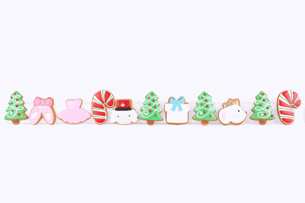Hand-iced Christmas biscuits appearing in a row