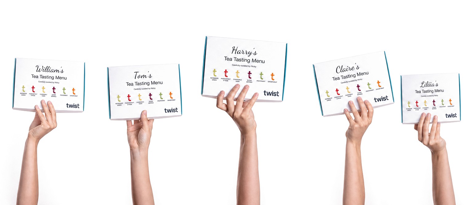 Five hands holding up personalised Twist tea tasting menus for William, Tom, Harry, Claire and Liliia
