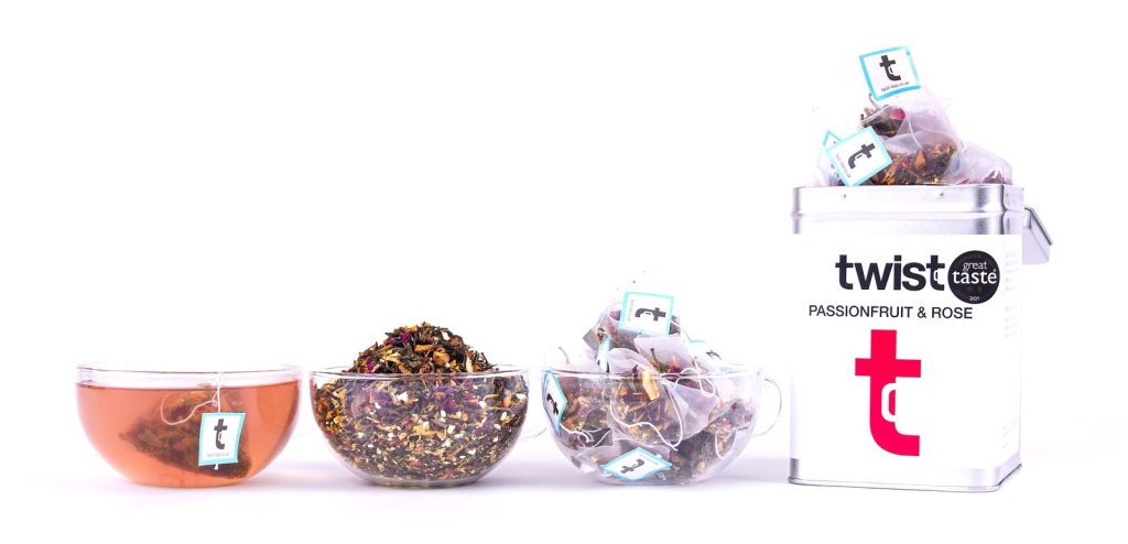Twist White Tea & Oolong: a cup of tea, the loose leaf and the caddy